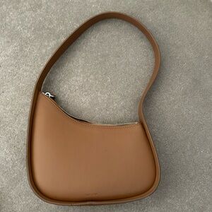 The Row Half Moon bag in brown / tan